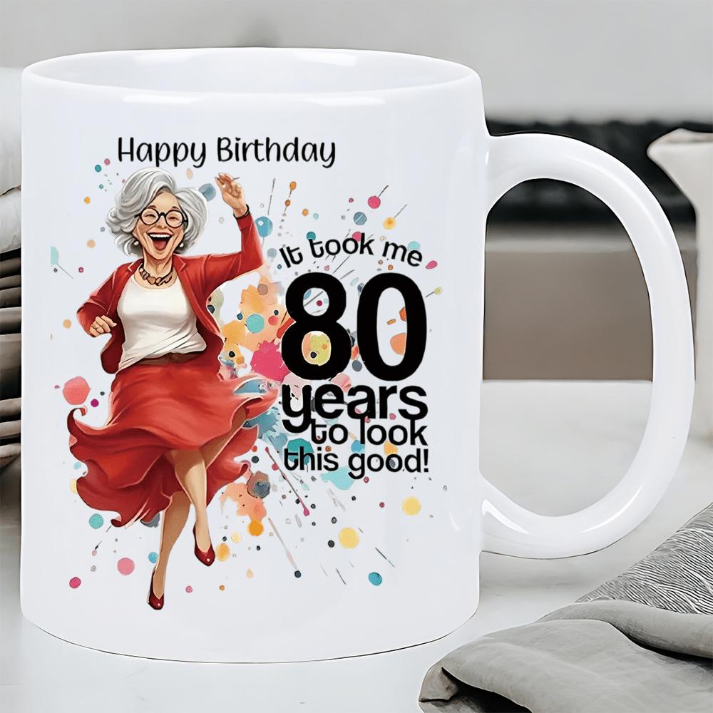 Tailorly White Ceramic 11 oz Mug - Happy Birthday It Took Me 80 Years To Look This Good Joyful Dancing Elderly Woman Among Vibrant Colorful Paint Splashes Lady