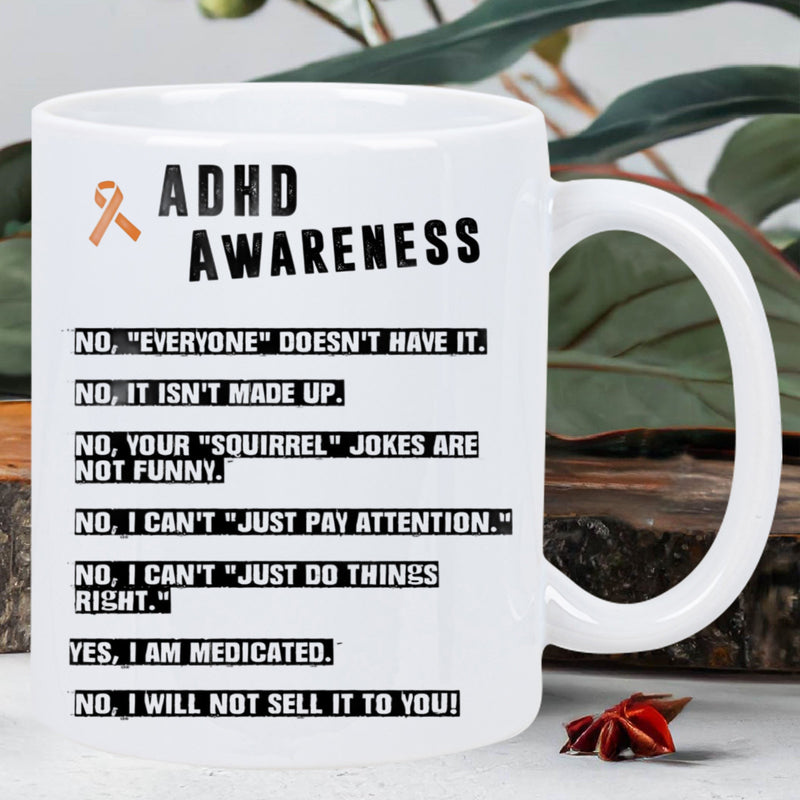 Tailorly White Ceramic 11 oz Mug - ADHD Awareness Minimalist Orange Ribbon Symbol Displaying Bold Black Text On Ceramic Surface Mug
