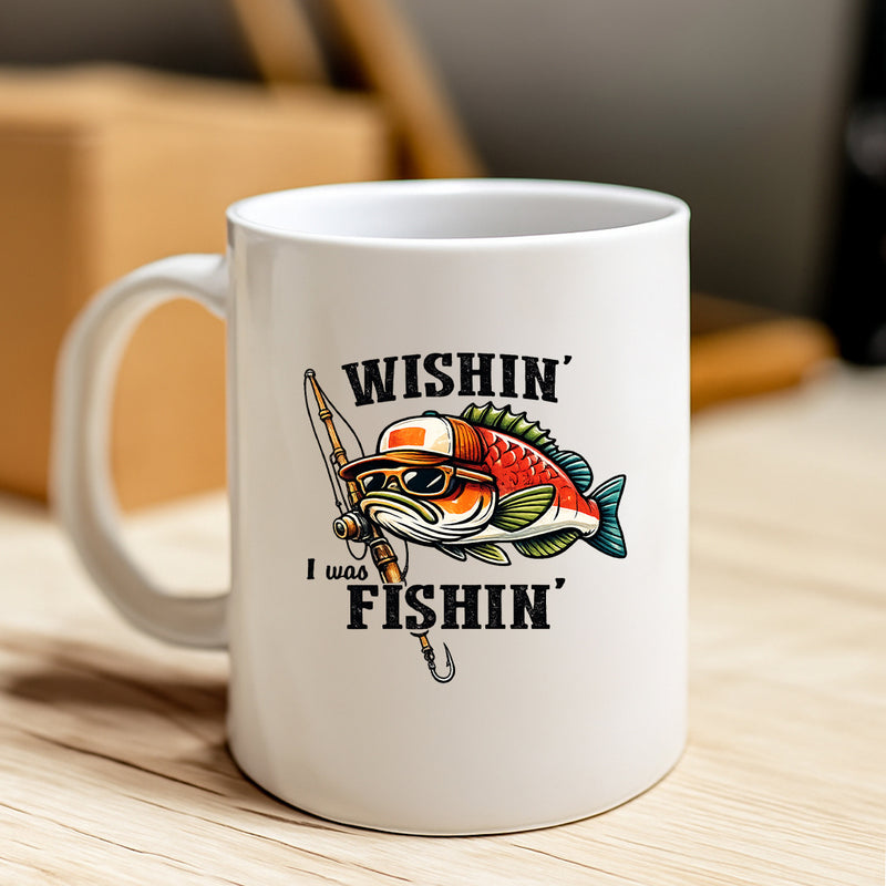 Tailorly White Ceramic 11 oz Mug - Wishin I Was Fishin Stylized Cartoon Bass Wearing Sunglasses And Trucker Hat Holding Rod Fish