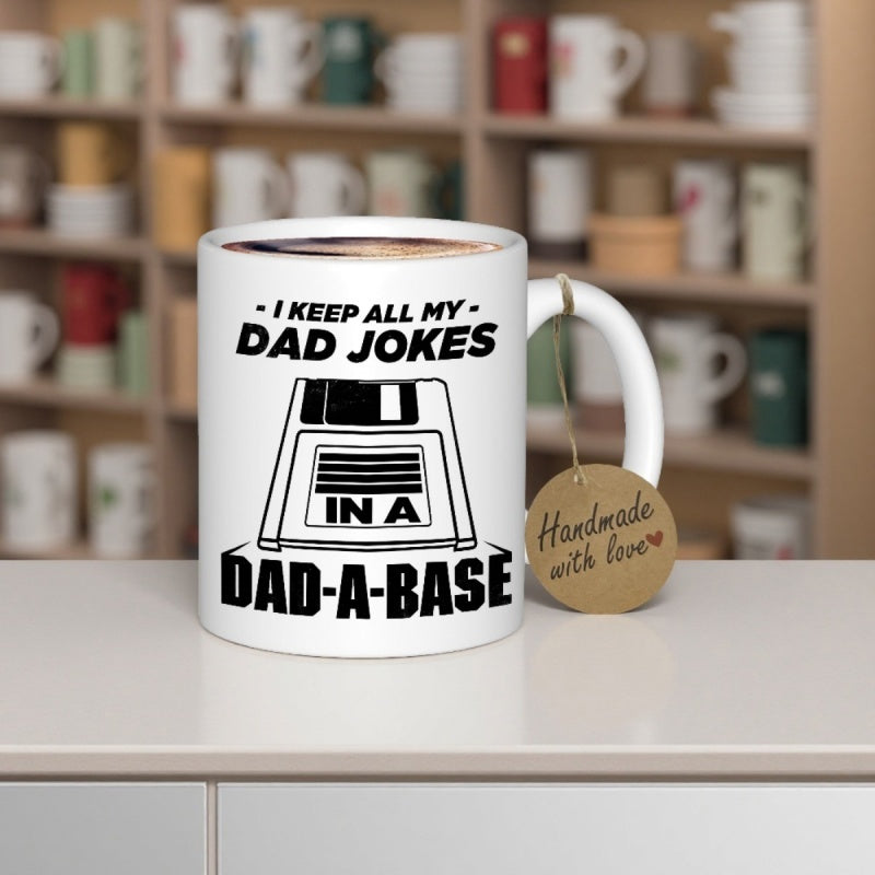 Tailorly White Ceramic 11 oz Mug - I Keep All My Dad Jokes In A Dad A Base Retro Style Floppy Disk Icon With Bold Minimalist Black And White Lines Floppy Disk