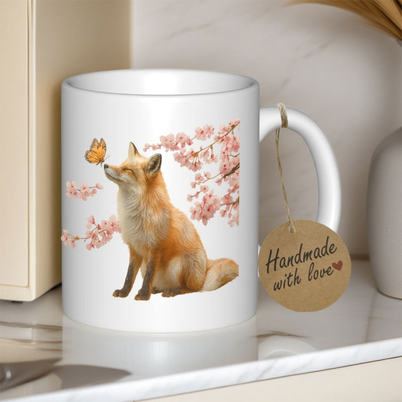 Tailorly White Ceramic 11 oz Mug - Handmade With Love Sitting Among Delicate Pink Cherry Blossoms With A Butterfly Perched On Nose Fox
