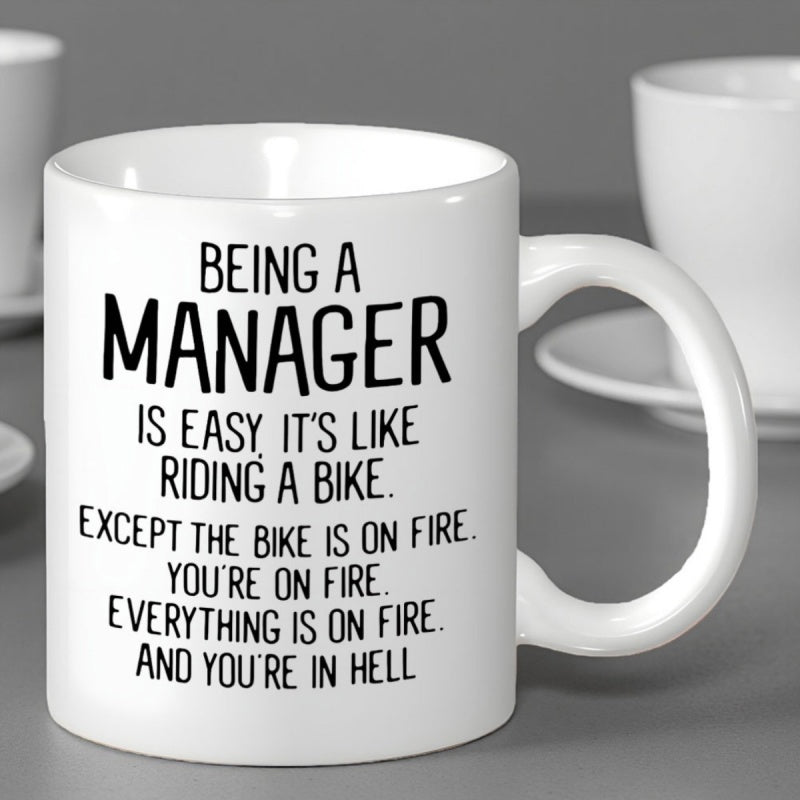 Tailorly White Ceramic 11 oz Mug - Being A Manager Is Easy It Is Like Riding A Bike Except The Bike Is On Fire You Are On Fire Everything Is On Fire And You Are In