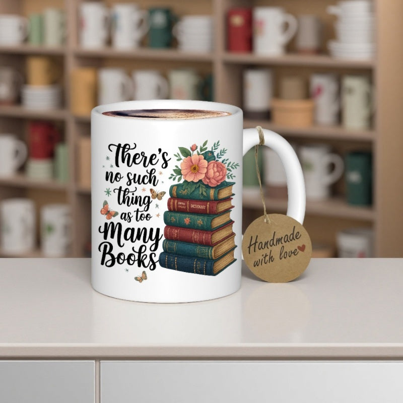 Tailorly White Ceramic 11 oz Mug - There Is No Such Thing As Too Many Books Colorful Stacked Hardcovers Adorned With Blooming Peach Flowers And Flying Butterflies