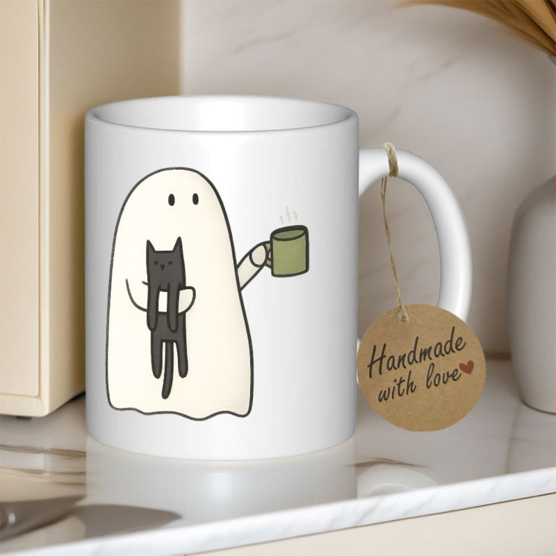 Tailorly White Ceramic 11 oz Mug - Handmade With Love Adorable Spooky Cartoon Figure Holding A Black Kitten While Carrying Coffee Ghost