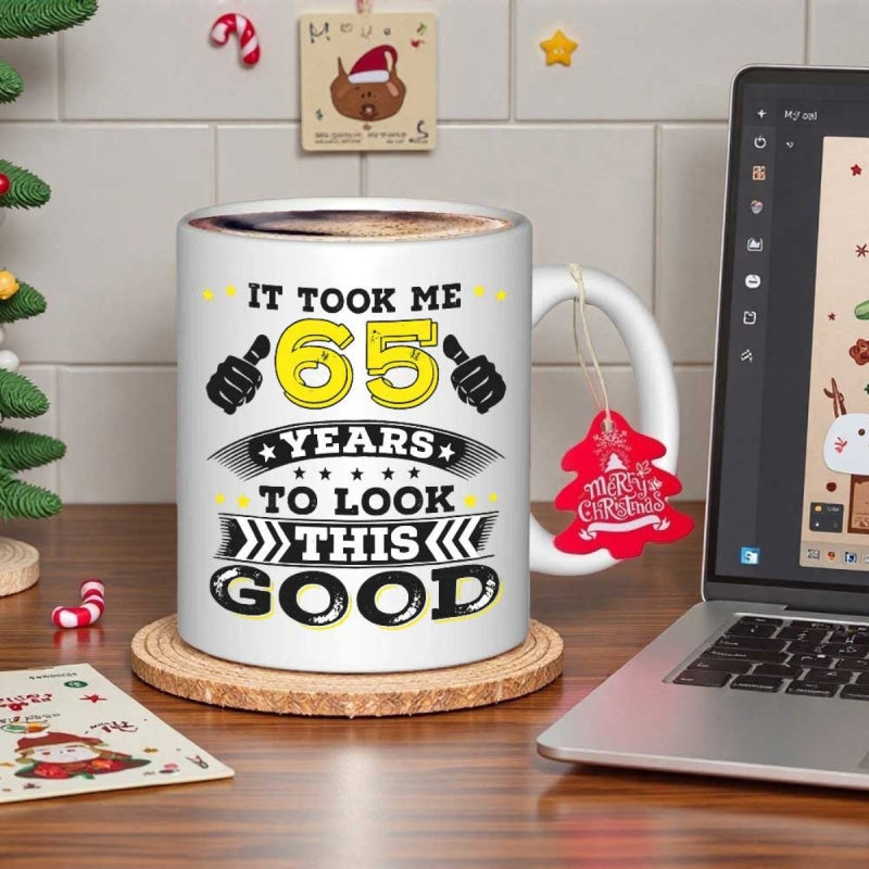 Tailorly White Ceramic 11 oz Mug - It Took Me 65 Years To Look This Good Bold Block Typography Featuring Thumbs Up Icons And Decorative Banners Badge