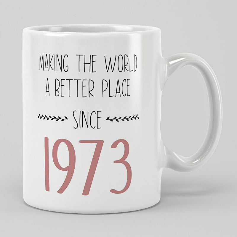 Tailorly White Ceramic 11 oz Mug - Making The World A Better Place Since 1973 Simple Decorative Foliage Accents Flanking Handwritten Style Typography And Large