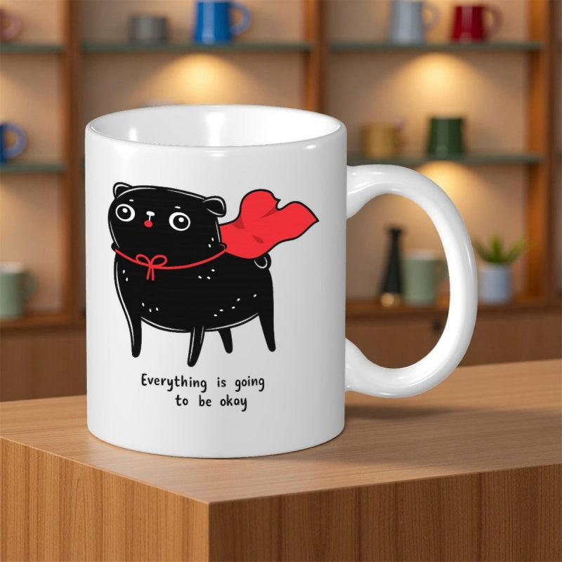 Tailorly White Ceramic 11 oz Mug - Everything Is Going To Be Okay Whimsical Small Black Cartoon Animal Wearing Bright Red Flowing Cape Cat
