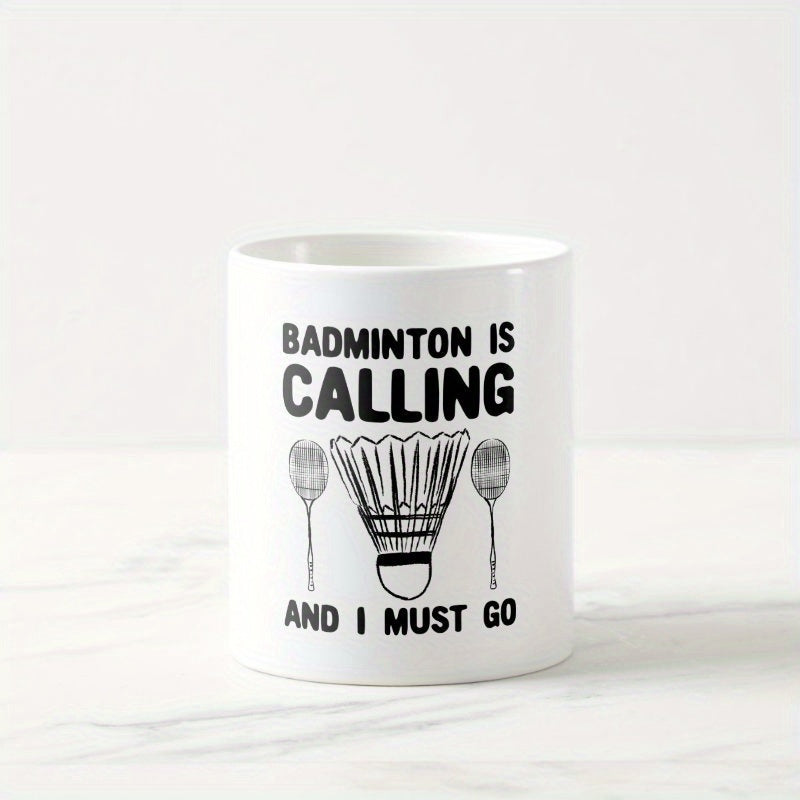Tailorly White Ceramic 11 oz Mug - Badminton Is Calling And I Must Go Symmetric Black Line Art Featuring Two Rackets Beside A Central Shuttlecock