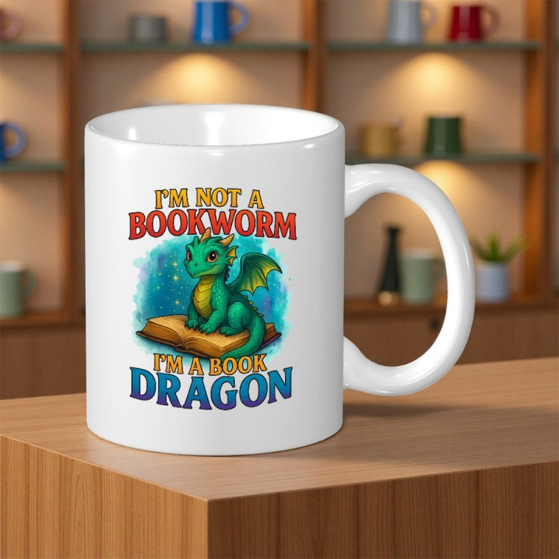 Tailorly White Ceramic 11 oz Mug - Im Not A Bookworm Im A Book Dragon Small Green Dragon Sitting Atop An Open Book Among Sparkling Stars Dragon