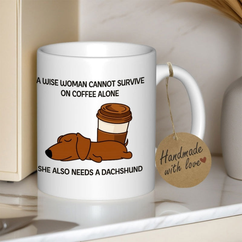 Tailorly White Ceramic 11 oz Mug - A Wise Woman Cannot Survive On Coffee Alone She Also Needs A Dachshund Cute Brown Wiener Dog Lying Flat Beside A Warm Takeaway