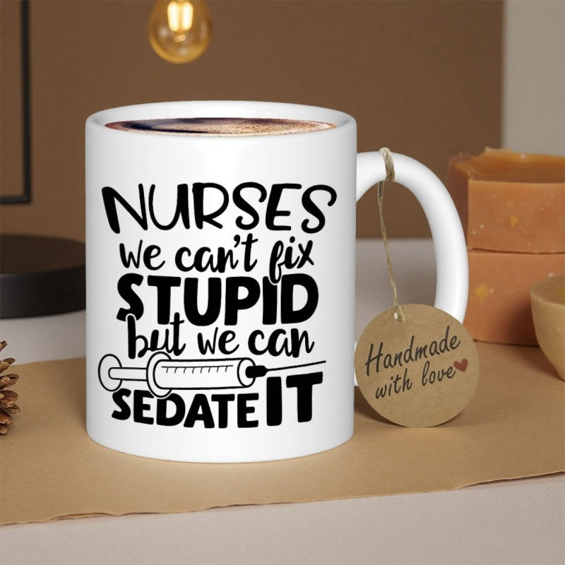 Tailorly White Ceramic 11 oz Mug - Nurses We Can’t Fix Stupid But We Can Sedate It Simple Black Line Art Syringe Integrated With Bold Decorative Typography Mug