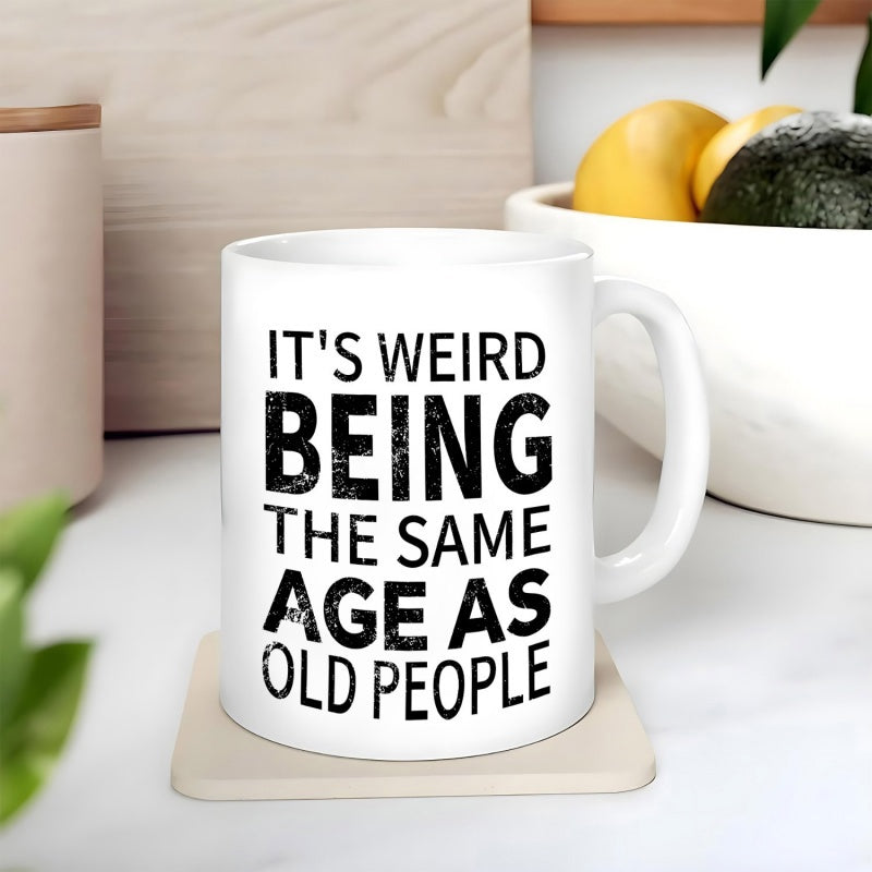 Tailorly White Ceramic 11 oz Mug - Its Weird Being The Same Age As Old People Distressed Bold Typography Design Displayed On A Minimalist Modern Background Sign
