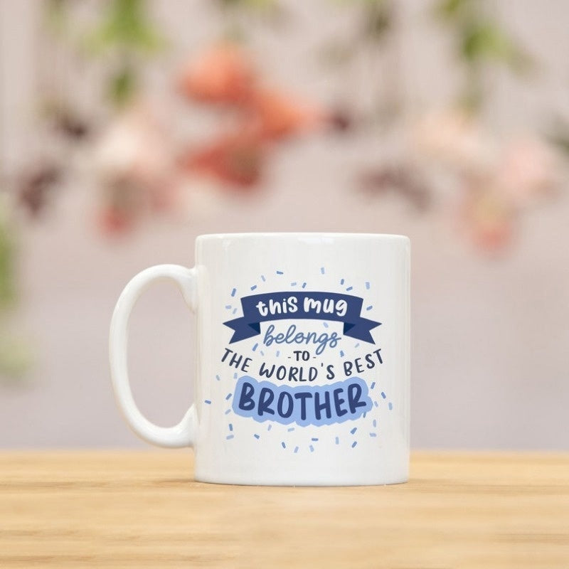 Tailorly White Ceramic 11 oz Mug - This Mug Belongs To The Worlds Best Brother Decorated With A Blue Banner And Confetti Accents Mug