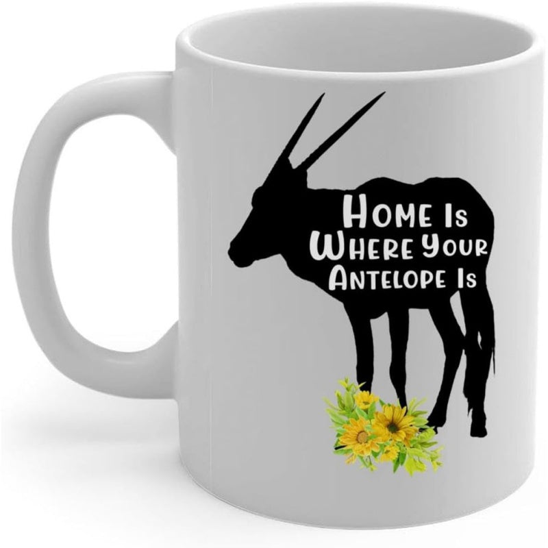 Tailorly White Ceramic 11 oz Mug - Home Is Where Your Antelope Is Majestic Black Animal Silhouette Standing Gracefully Above Vibrant Yellow Sunflower Blossoms