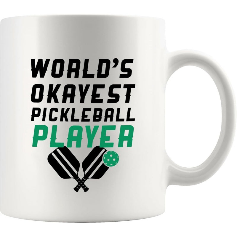 Tailorly White Ceramic 11 oz Mug - Worlds Okayest Pickleball Player Two Crossed Black Sporting Paddles With A Small Green Ball Pickleball Paddle