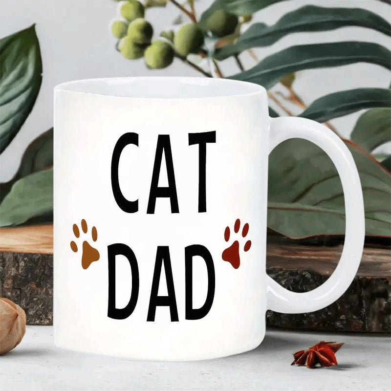 Tailorly White Ceramic 11 oz Mug - Cat Dad Simple Ceramic Surface Featuring Cute Brown Paw Prints Beside The Text Mug