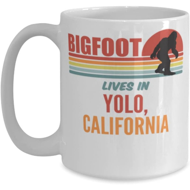 Tailorly White Ceramic 11 oz Mug - Bigfoot Lives In Yolo California Walking Silhouette Among Retro Vintage Sunset Stripes Within Colorful Landscape Bigfoot