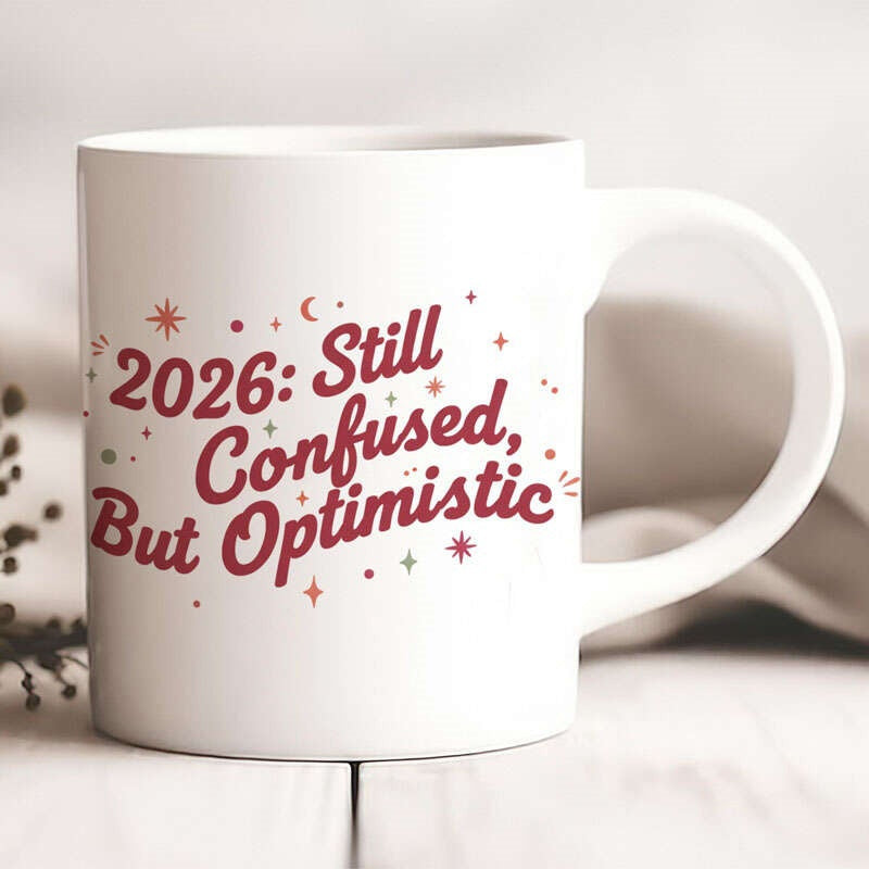 Tailorly White Ceramic 11 oz Mug - 2026 Still Confused But Optimistic Minimalist Stars And Crescent Moons Surrounding Artistic Handwritten Script Text Mug