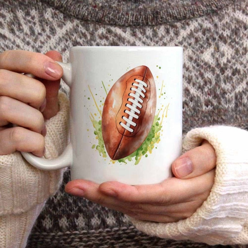 Tailorly White Ceramic 11 oz Mug - Artistic Watercolor Brown Sports Ball Among Vibrant Green Splattered Grass Football