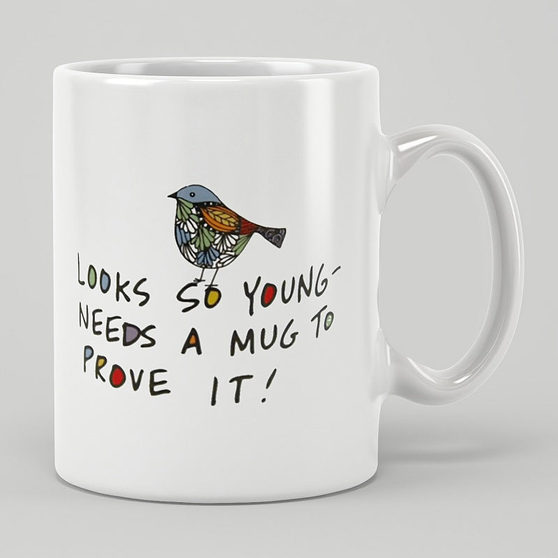 Tailorly White Ceramic 11 oz Mug - Looks So Young Needs A Mug To Prove It Colorful Folk Art Patterned Songbird Perched Above Humorous Script Bird