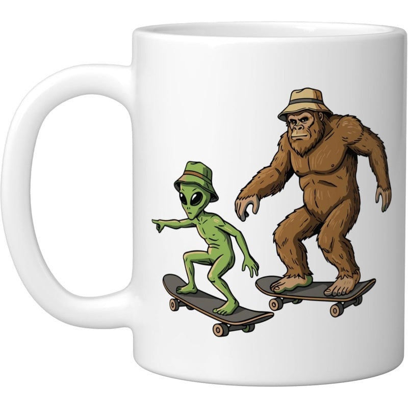 Tailorly White Ceramic 11 oz Mug - Cartoon Alien And Sasquatch Wearing Bucket Hats Riding Together Skateboarders