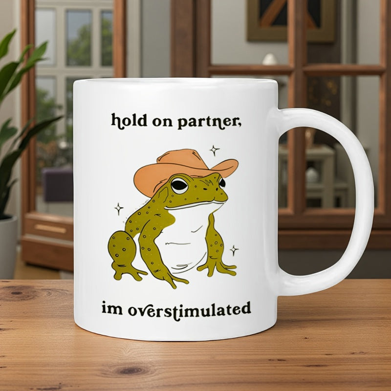 Tailorly White Ceramic 11 oz Mug - Hold On Partner Im Overstimulated Green Toad Wearing Western Cowboy Hat Surrounded By Bright Sparkle Stars Frog