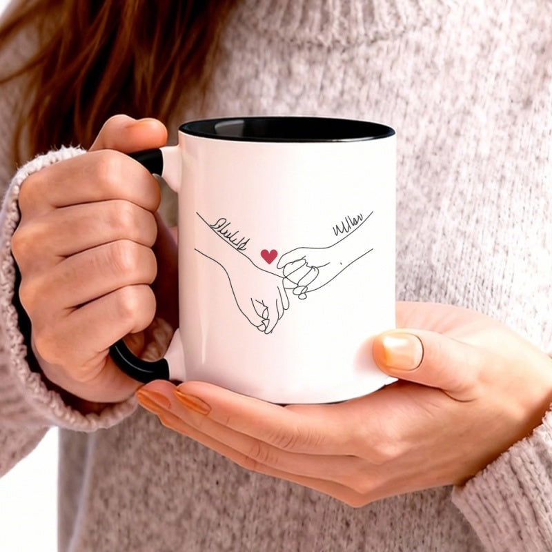 Tailorly Black Accent 11 oz Mug - holding heart with names above personalized valentines day gifts