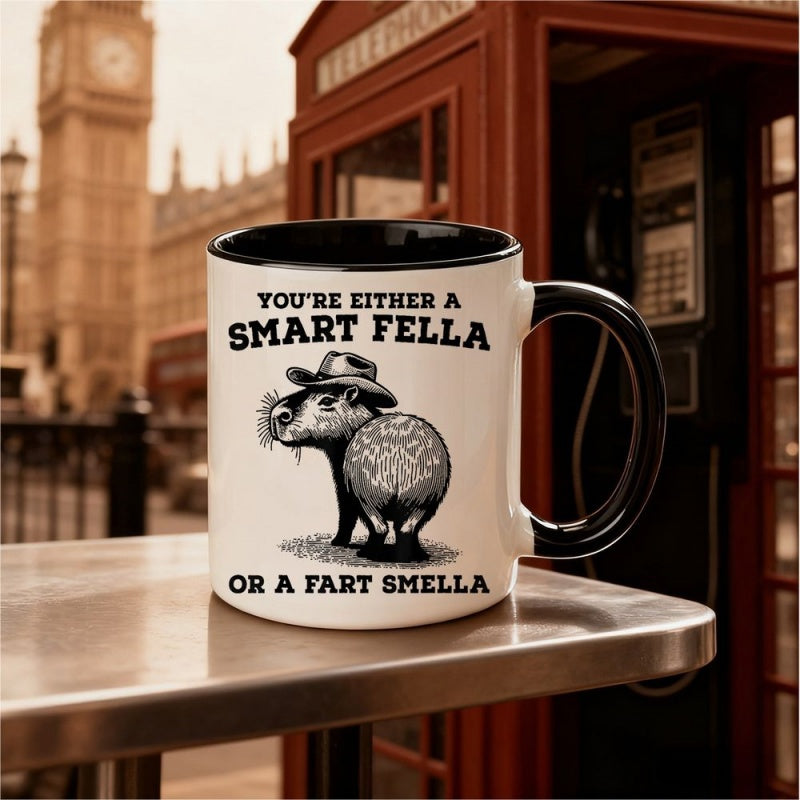 Tailorly Black Accent 11 oz Mug - funny capybara with cowboy hat and quote "youre either a smart or a fart"