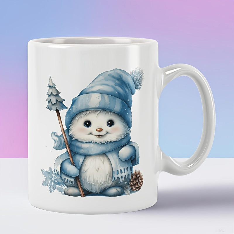 Tailorly White Ceramic 11 oz Mug - Adorable Furry Snow Creature Wearing Knitted Winter Accessories Holding Small Tree Creature