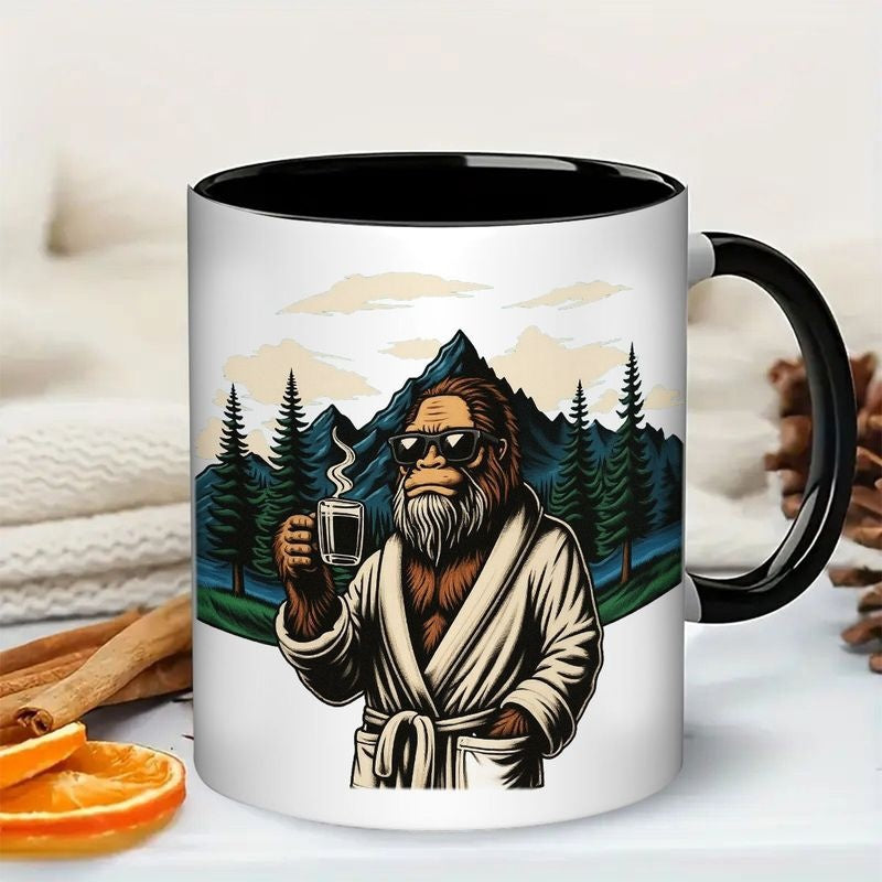 Tailorly Black Accent 11 oz Mug - funny sasquatch in robe with coffee cup