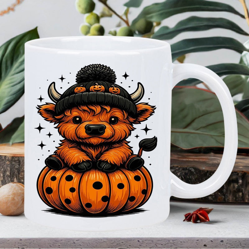 Tailorly White Ceramic 11 oz Mug - Adorable Orange Highland Calf Wearing Black Beanie Sitting Atop Halloween Cow