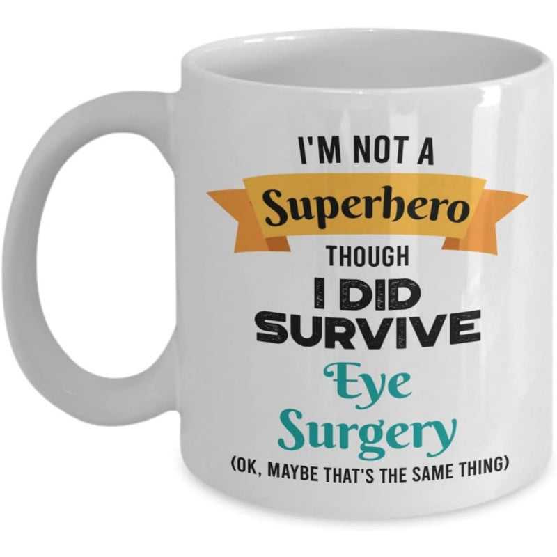 Tailorly White Ceramic 11 oz Mug - Im Not A Superhero Though I Did Survive Eye Surgery Ok Maybe Thats The Same Thing Glossy White Ceramic Kitchenware Accessory