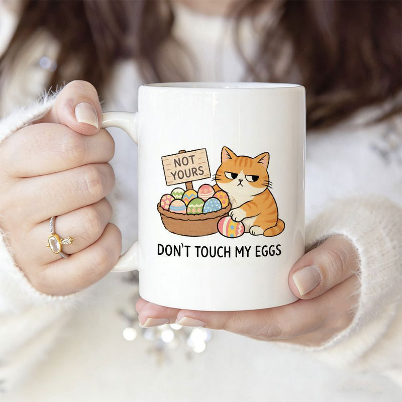 Tailorly White Ceramic 11 oz Mug - Not Yours Dont Touch My Eggs Grumpy Orange Cat Guarding Basket Full Of Colorful Eggs Cat