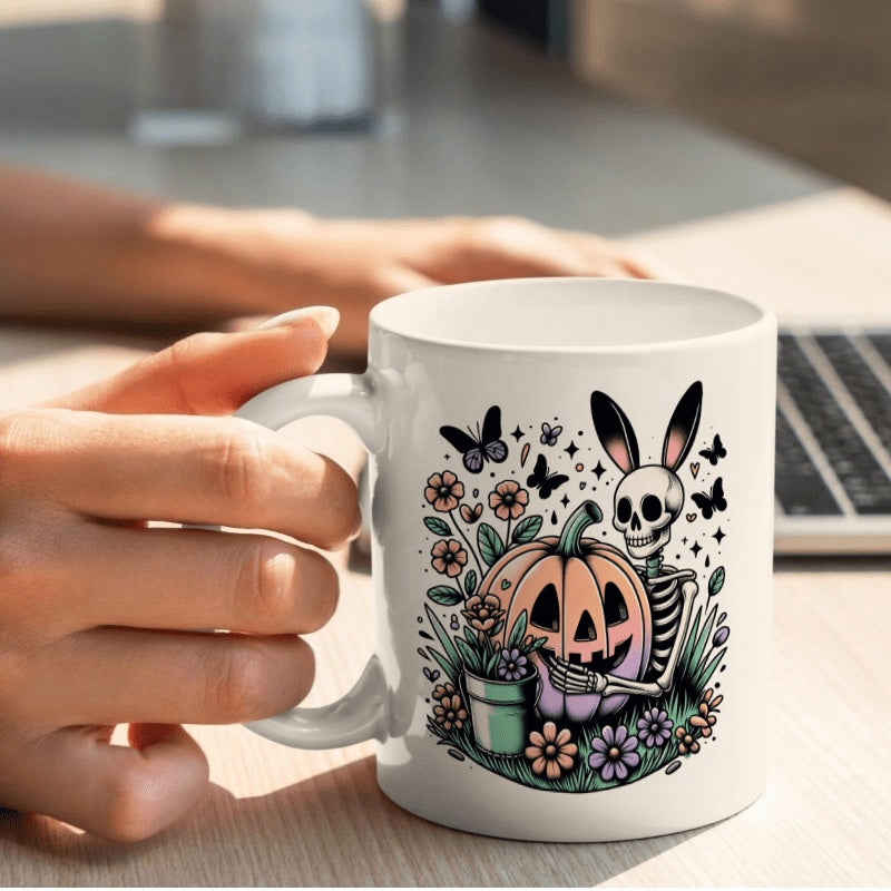 Tailorly White Ceramic 11 oz Mug - Whimsical Halloween Skeleton Wearing Bunny Ears Hugging Carved Jack O Lantern Skeleton