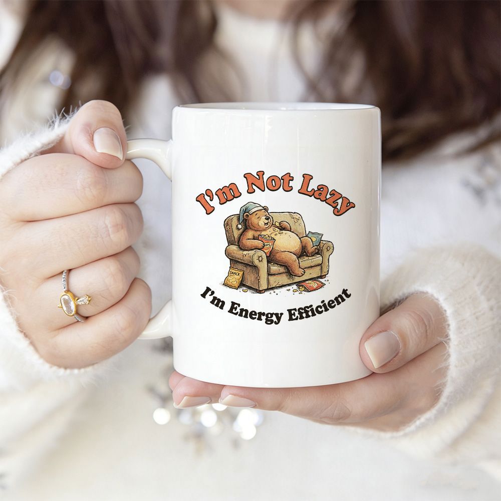 Tailorly White Ceramic 11 oz Mug - Im Not Lazy Im Energy Efficient Resting Peacefully On A Comfortable Cozy Tan Living Room Couch Bear