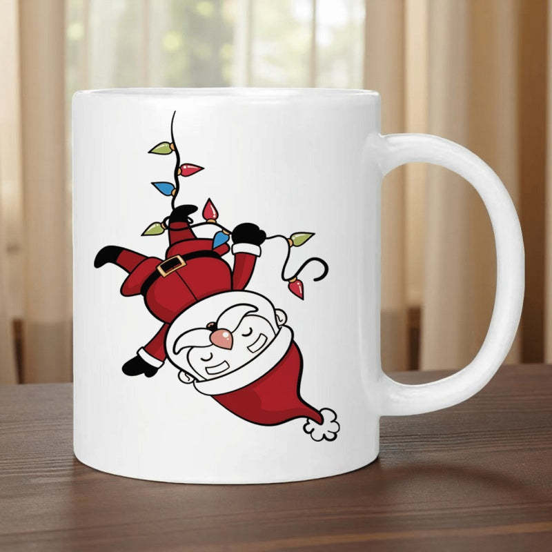 Tailorly White Ceramic 11 oz Mug - Jolly Santa Claus Hanging Upside Down Among Festive Colorful String Lights Santa