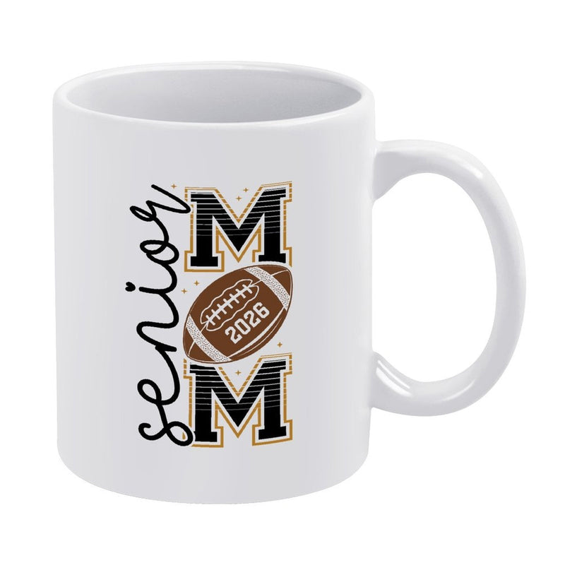Tailorly White Ceramic 11 oz Mug - Senior Mom 2026 Classic Brown Textured Pigskin Between Two Large Block Letters Football