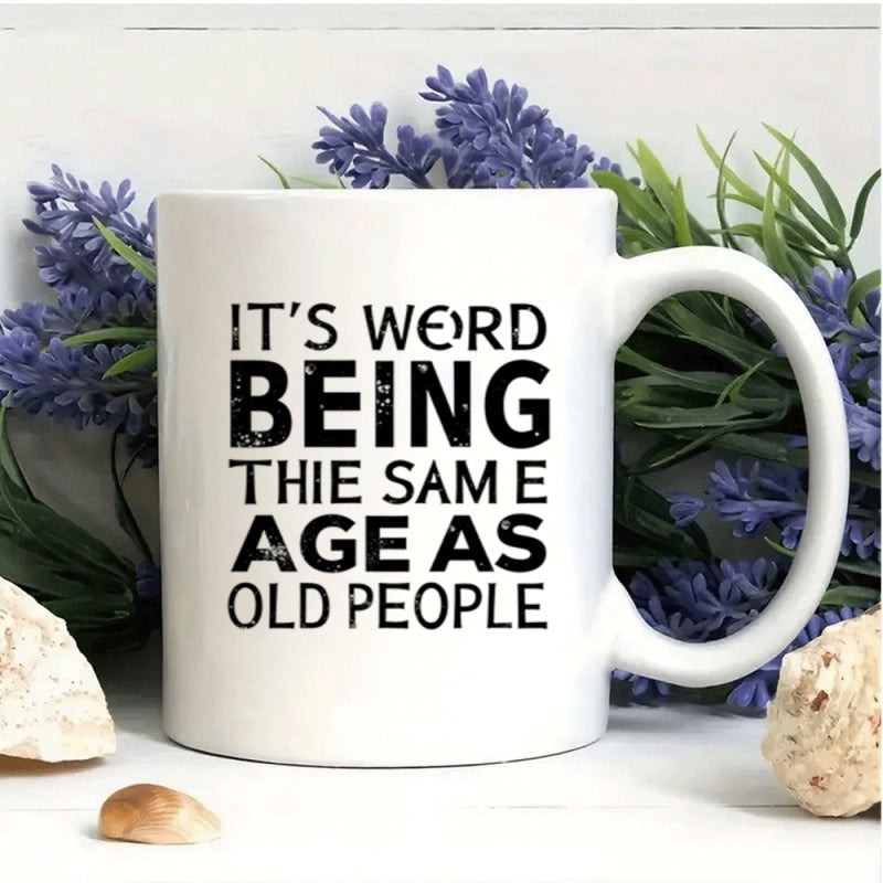Tailorly White Ceramic 11 oz Mug - Its Weird Being The Same Age As Old People Minimalist Black Typography Stencil Style Bold Lettering On Smooth Metal Sign