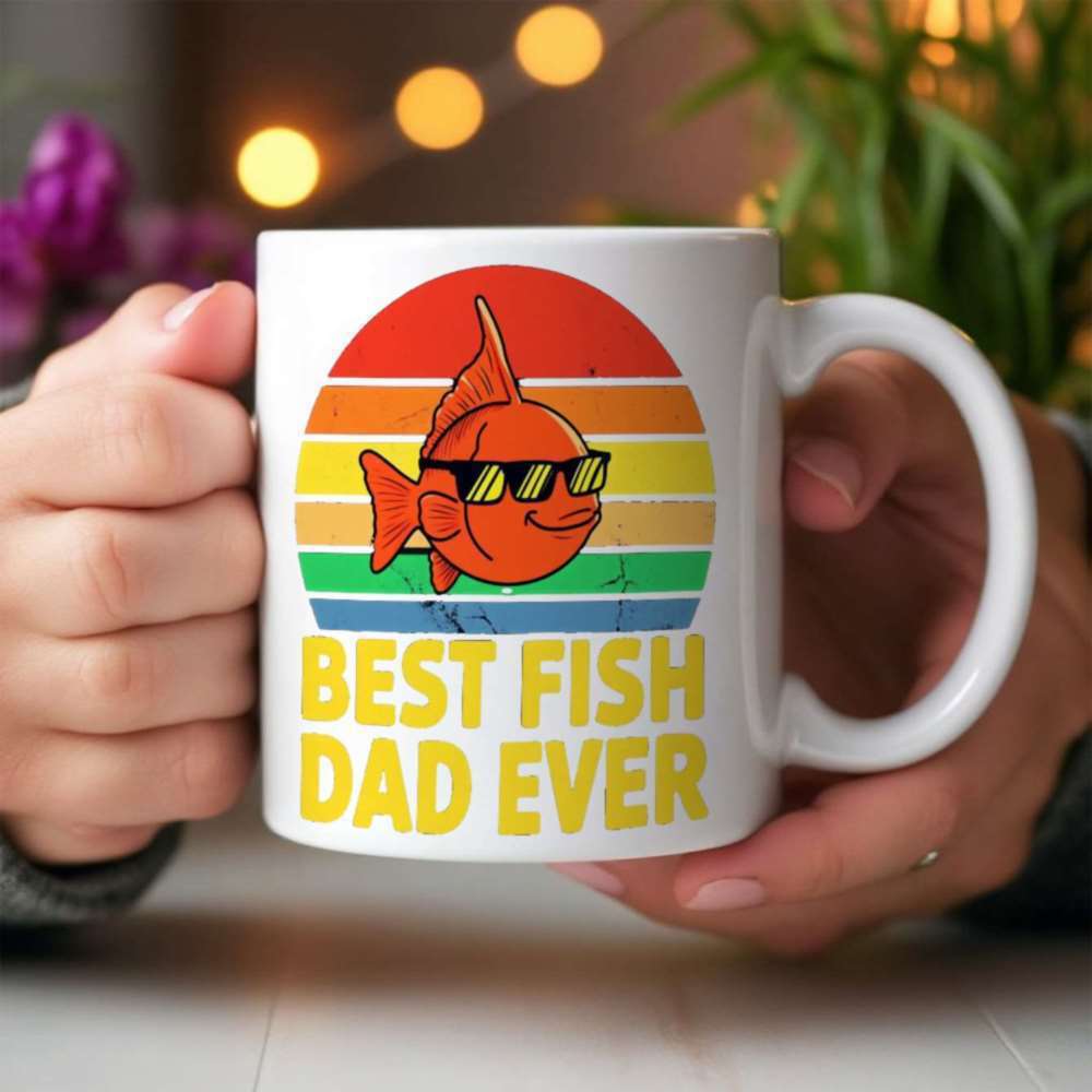 Tailorly White Ceramic 11 oz Mug - Best Fish Dad Ever Smiling Orange Cartoon Fish Wearing Sunglasses Against A Colorful Retro Sunset Fish