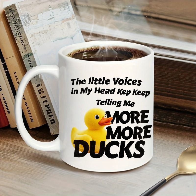 Tailorly White Ceramic 11 oz Mug - The Little Voices In My Head Keep Telling Me More More Ducks Bright Yellow Rubber Bath Toy Sitting Beside Bold Black Typography