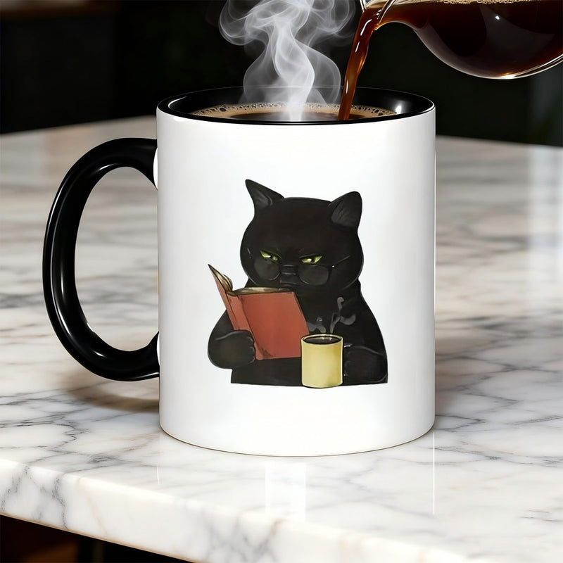 Tailorly Black Accent 11 oz Mug - Black cat with coffee mug and book-themed design