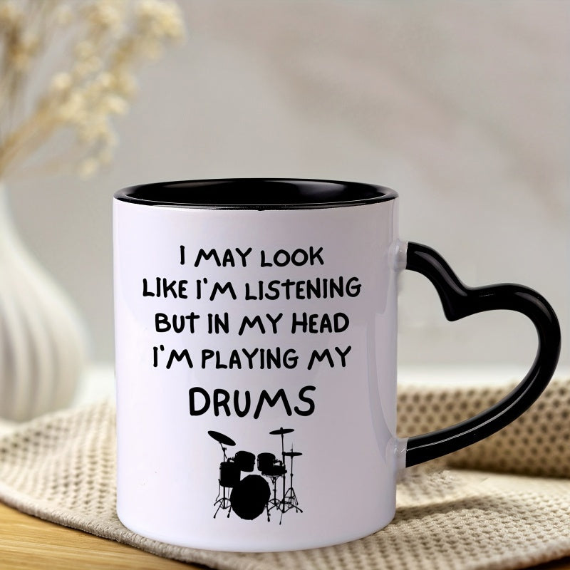Tailorly Black Accent 11 oz Mug - heart shaped handle with "i may i'm listening but in i'm playing my drums" text