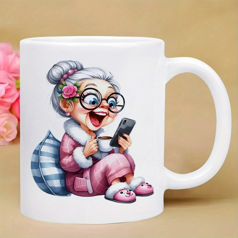 Tailorly White Ceramic 11 oz Mug - Happy Cartoon Lady Holding Coffee And Smartphone Wearing Pink Pajamas Grandmother