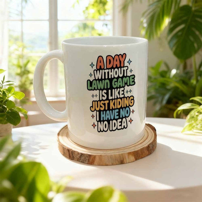 Tailorly White Ceramic 11 oz Mug - A Day Without Lawn Game Is Like Just Kidding I Have No Idea White Ceramic Body Decorated With Colorful Playful Text And Stars