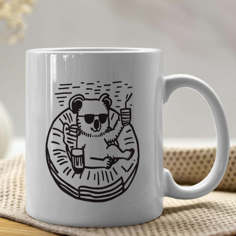 Tailorly White Ceramic 11 oz Mug - Chilling In An Inflatable Ring Holding A Drink And Relaxing Koala