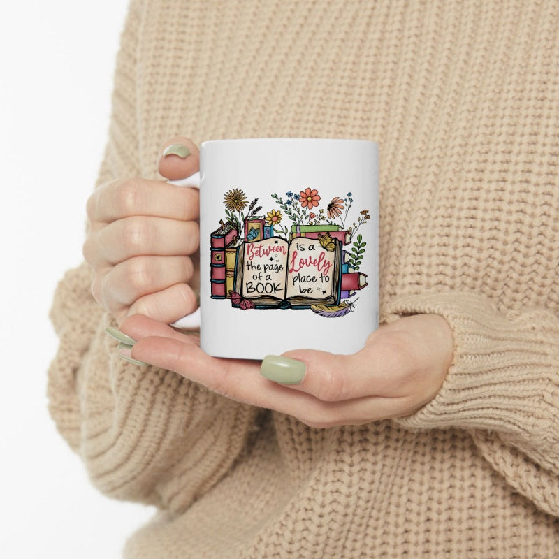 Tailorly White Ceramic 11 oz Mug - Between The Pages Of A Book Is A Lovely Place To Be Delicate Floral Elements Sprouting From An Open Hand Drawn Illustrated Book