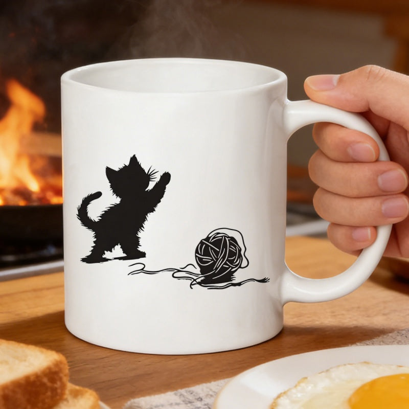 Tailorly White Ceramic 11 oz Mug - Playful Black Silhouette Reaching Toward A Ball Of Tangled Yarn Kitten