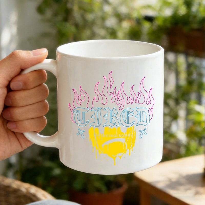 Tailorly White Ceramic 11 oz Mug - Tired Pink Outlined Flames Above Gothic Lettering With Yellow Dripping Paint Design