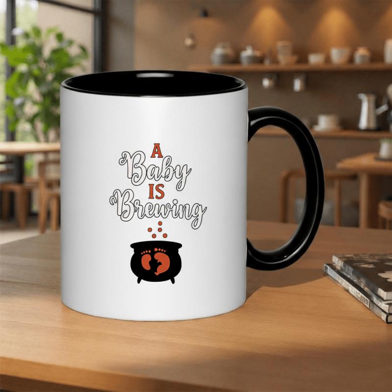 Tailorly Black Accent 11 oz Mug - a baby is brewing text with witchy baby shower themed design