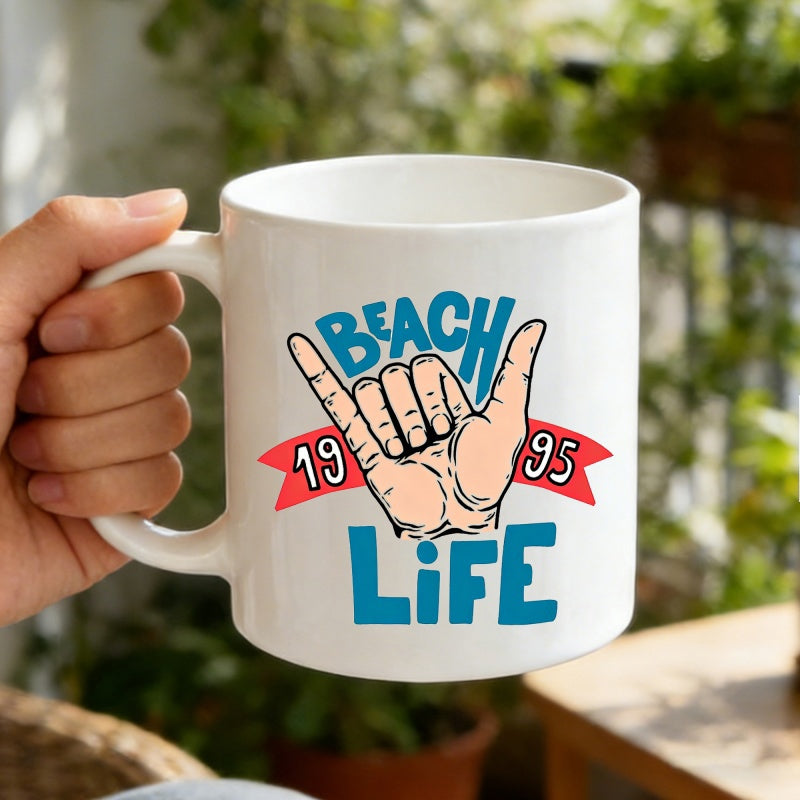 Tailorly White Ceramic 11 oz Mug - Beach Life 1995 Artistic Shaka Sign With Blue Text And A Red Ribbon Banner Hand